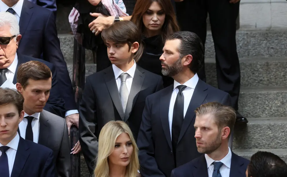 Former U.S. President Donald Trump, his wife Melania, his daughter Ivanka, her husband Jared Kushner and his granddaughter Kai Madison leave St. Vincent Ferrer Church during the funeral of Ivana Trump, socialite and Trump's first wife, in New York City, U.S., July 20, 2022.  REUTERS/Brendan McDermid PEOPLE-IVANA TRUMP/FUNERAL