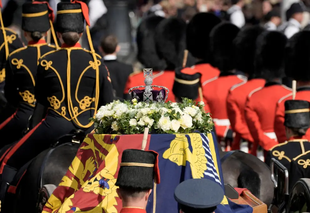 The coffin of Queen Elizabeth II leaves Buckingham Palace for Westminster Hall in London, Wednesday, Sept. 14, 2022.  Vadim Ghirda/Pool via REUTERS BRITAIN-ROYALS/QUEEN