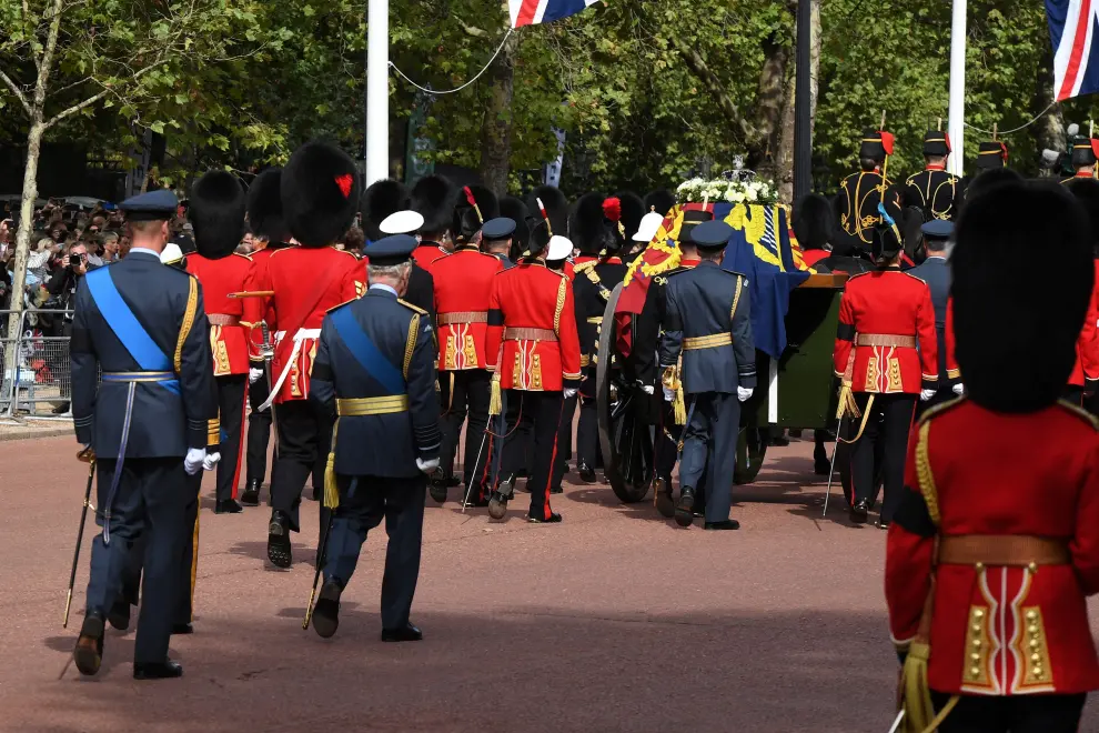 Britain's Camilla, Queen Consort and Britain's Catherine, Princess of Wales are driven behind the coffin of Queen Elizabeth II, adorned with a Royal Standard and the Imperial State Crown and pulled by a Gun Carriage of The King's Troop Royal Horse Artillery, during a procession from Buckingham Palace to the Palace of Westminster, in London on September 14, 2022. DANIEL LEAL/Pool via REUTERS BRITAIN-ROYALS/QUEEN