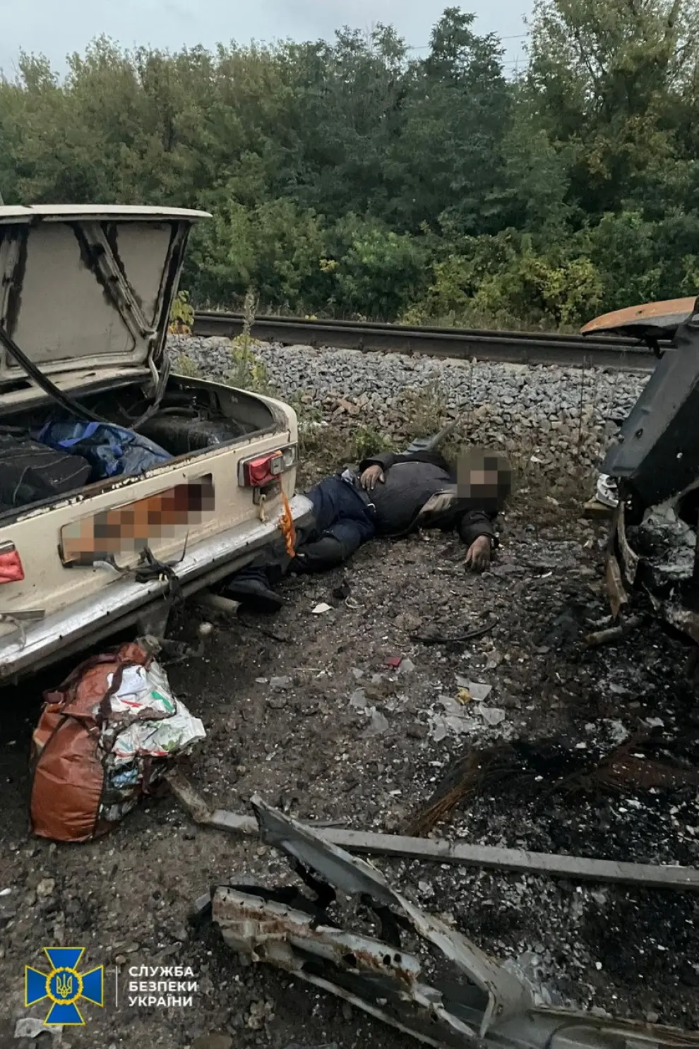 Aftermath of a suspected strike on a civilian convoy on the railway between Svatove and Kupiansk