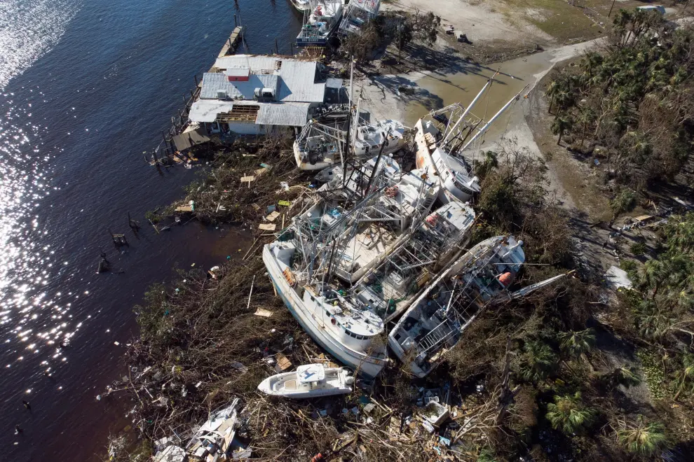 Stranded shrimp boats are seen in a marina after Hurricane Ian caused widespread destruction in Fort Myers Beach, Florida, U.S., September 30, 2022. REUTERS/Marco Bello STORM-IAN/FLORIDA