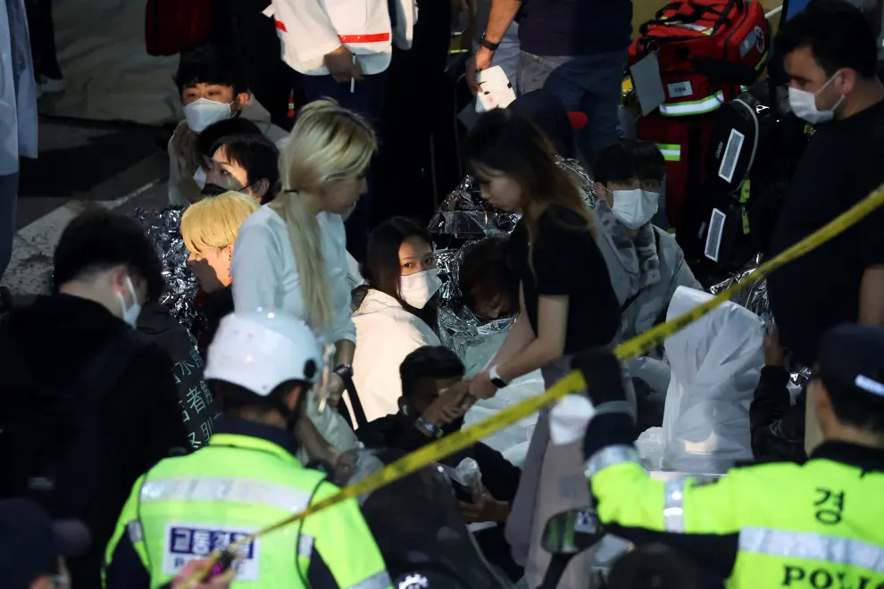 Rescue teams work at the scene where dozens of people were injured in a stampede during a Halloween festival in Seoul, South Korea, October 29, 2022. REUTERS/Kim Hong-ji SOUTHKOREA-STAMPEDE/