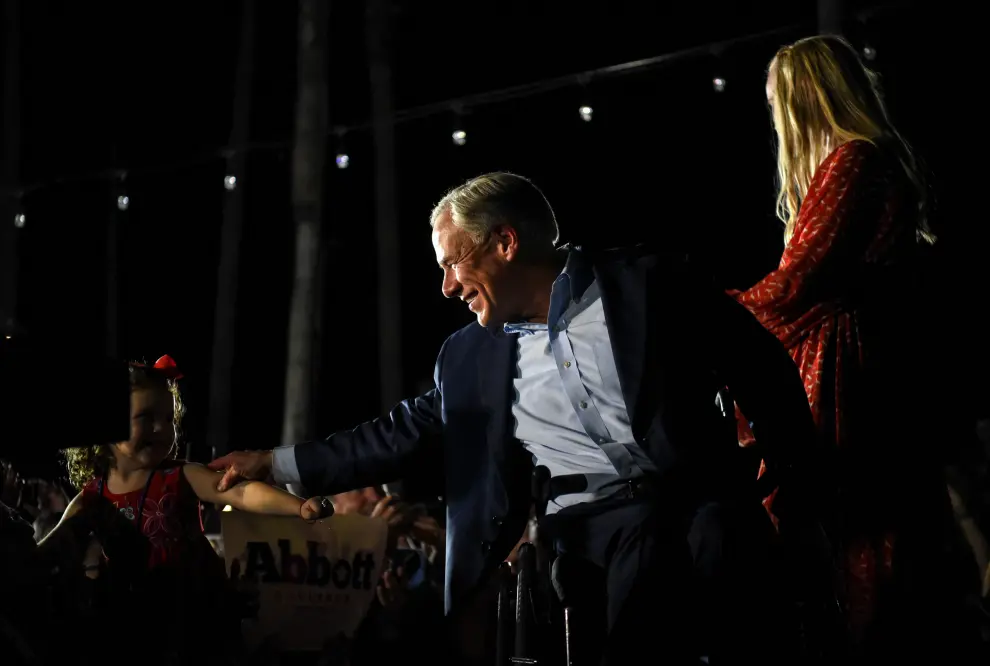 Republican Governor Greg Abbott greets supporters during his 2022 U.S. midterm elections night party in McAllen, Texas, U.S., November 8, 2022. REUTERS/Callaghan O'Hare USA-ELECTION/TEXAS