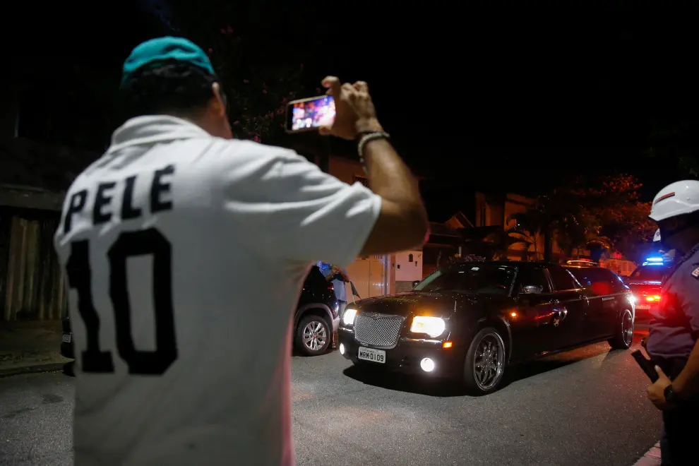 A view of police cars as the body of Brazil's soccer legend Pele, which is being transported in a car, arrives at Santos city for a public mass, in Sao Paulo, Brazil January 2, 2023. REUTERS/Carla Carniel SOCCER-PELE/