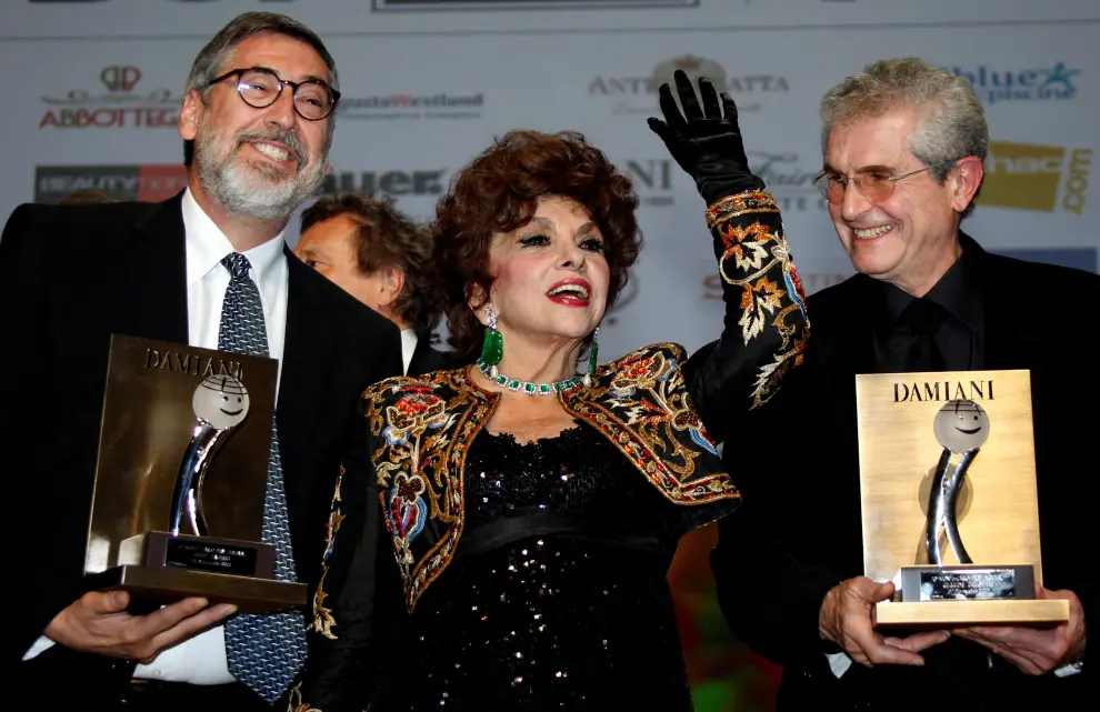 FILE PHOTO: Film directors Landis of the U.S and Lelouch of France pose with Italian actress Lollobrigida at the 10th Monte-Carlo Film festival in Monaco