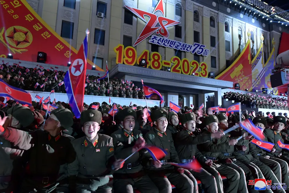 People wave flags during a military parade to mark the 75th founding anniversary of North Korea's army, in Pyongyang, North Korea February 8, 2023, in this photo released by North Korea's Korean Central News Agency (KCNA).    KCNA via REUTERS    ATTENTION EDITORS - THIS IMAGE WAS PROVIDED BY A THIRD PARTY. REUTERS IS UNABLE TO INDEPENDENTLY VERIFY THIS IMAGE. NO THIRD PARTY SALES. SOUTH KOREA OUT. NO COMMERCIAL OR EDITORIAL SALES IN SOUTH KOREA. NORTHKOREA-MILITARY/ANNIVERSARY-PARADE