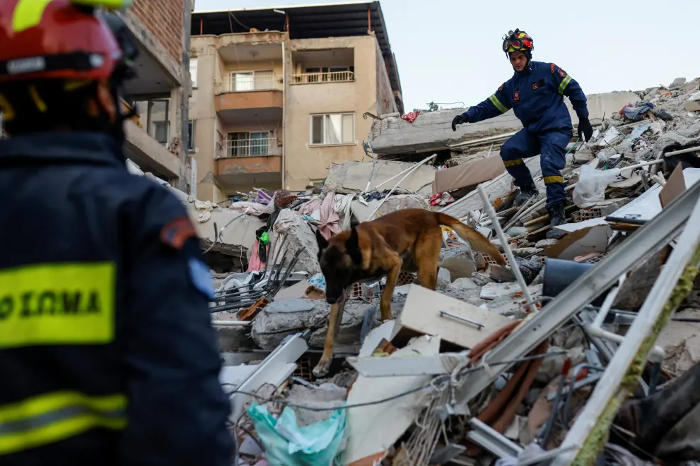 Members of a Greek rescue team work on the site of a collapsed building, as the search for survivors continues, in the aftermath of a deadly earthquake, in Hatay, Turkey February 11, 2023. REUTERS/Kemal Aslan TURKEY-QUAKE/