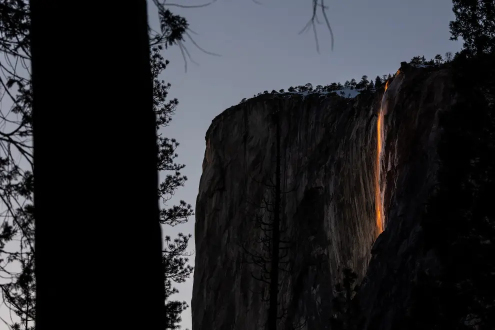 Horsetail Fall at El Capitan is seen during sunset in Yosemite National Park, California, U.S., February 15, 2023. The phenomenon of this vista only occurs for only few days in February each year when several weather and climatic conditions are just right. REUTERS/Carlos Barria USA-YOSEMITE/HORSETAIL-FALL
