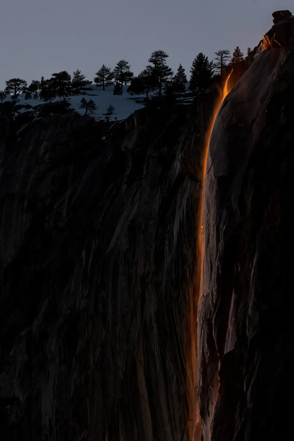 Horsetail Fall at El Capitan is seen during sunset in Yosemite National Park, California, U.S., February 15, 2023. The phenomenon of this vista only occurs for only few days in February each year when several weather and climatic conditions are just right. REUTERS/Carlos Barria USA-YOSEMITE/HORSETAIL-FALL