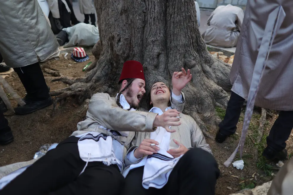 Ultra-Orthodox Jewish men and boys dressed in costumes celebrate the Jewish holiday of Purim, in Mea Shearim neighbourhood, in Jerusalem March 8, 2023. REUTERS/Ammar Awad RELIGION-PURIM/JERUSALEM