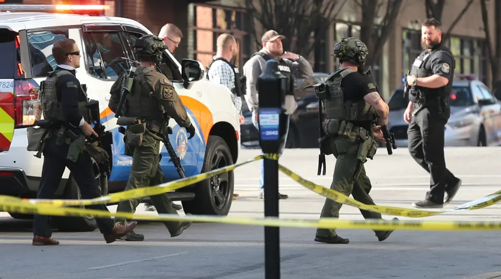 People embrace after an "active police situation" that included mass casualties at Old National Bank in Louisville, Kentucky, U.S. April 10, 2023 in a still image from video.  ABC affiliate WHAS via REUTERS. NO RESALES. NO ARCHIVES. MANDATORY CREDIT KENTUCKY-SHOOTING/