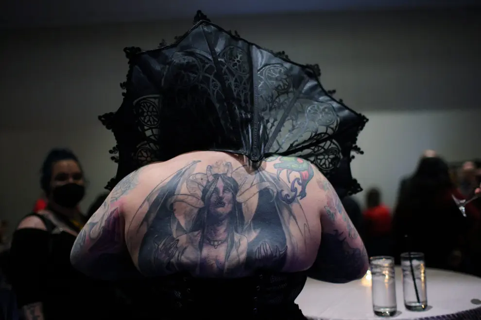 An attendee poses for a photograph at the Satanic Ball during the Satanic Temple's Satancon 2023, which they call an "in-person conference for congregations, campaigns, members, and supporters," in Boston, Massachusetts, U.S., April 28, 2023.  The Satanic Temple describes itself as "the primary religious Satanic organization in the world."    REUTERS/Brian Snyder USA-DAILYLIFE/