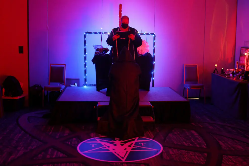 An attendee prepares for their "Unbaptism Ceremony" in the Little Black Chapel during the Satanic Temple's Satancon 2023, which they call an "in-person conference for congregations, campaigns, members, and supporters," in Boston, Massachusetts, U.S., April 28, 2023.  The Satanic Temple describes itself as "the primary religious Satanic organization in the world." REUTERS/Brian Snyder USA-DAILYLIFE/