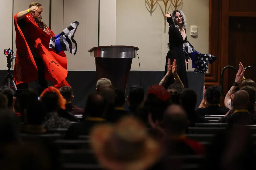 An attendee poses for a photograph inside the Little Black Chapel at the Satanic Temple's Satancon 2023, which they call an "in-person conference for congregations, campaigns, members, and supporters," in Boston, Massachusetts, U.S., April 28, 2023.  The Satanic Temple describes itself as "the primary religious Satanic organization in the world." REUTERS/Brian Snyder USA-DAILYLIFE/