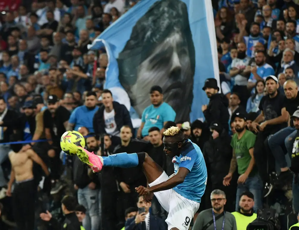 Soccer Football - Serie A - Udinese v Napoli - Dacia Arena, Udine, Italy - May 4, 2023 Napoli fans with a Diego Maradona flag REUTERS/Jennifer Lorenzini SOCCER-ITALY-UDI-NAP/REPORT