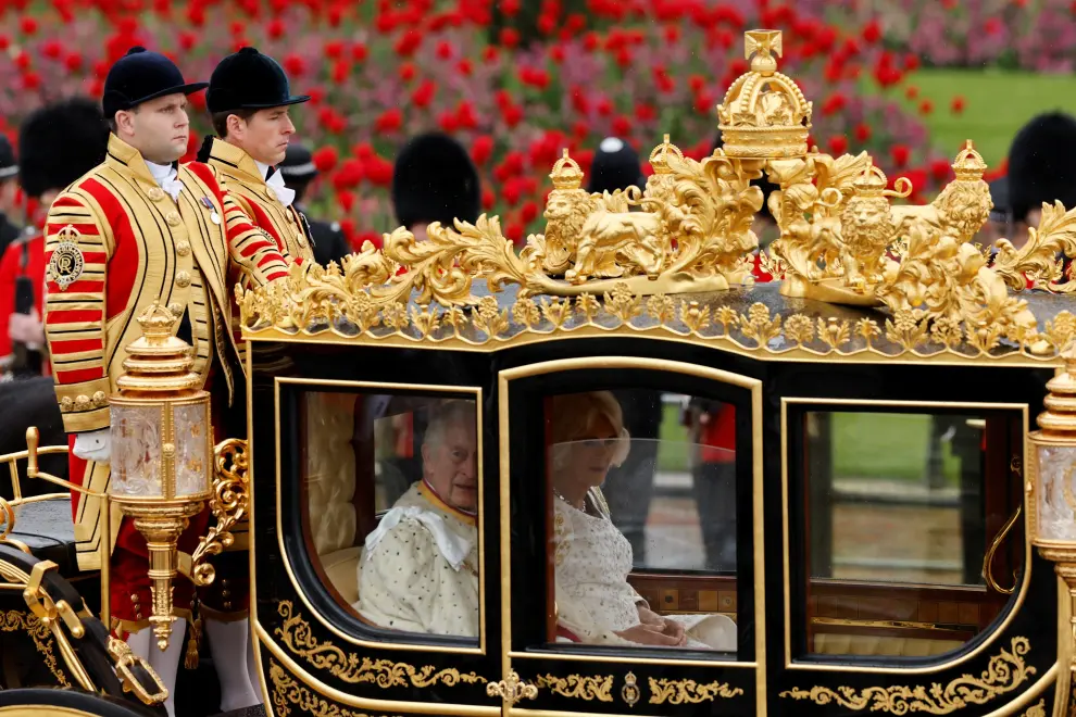 Britain's King Charles and Queen Camilla sit in Diamond Jubilee State Coach at Buckingham Palace on the day of coronation ceremony, in London, Britain May 6, 2023. REUTERS/Hannah McKay BRITAIN-ROYALS/CORONATION