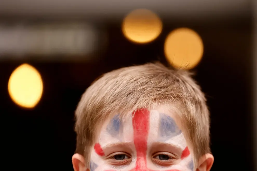 A child has a Union Jack flag painted on his face for a party in St James Church to celebrate Britain's King Charles' coronation, in London, Britain, May 7, 2023. REUTERS/Yara Nardi BRITAIN-ROYALS/CORONATION-BIG LUNCH
