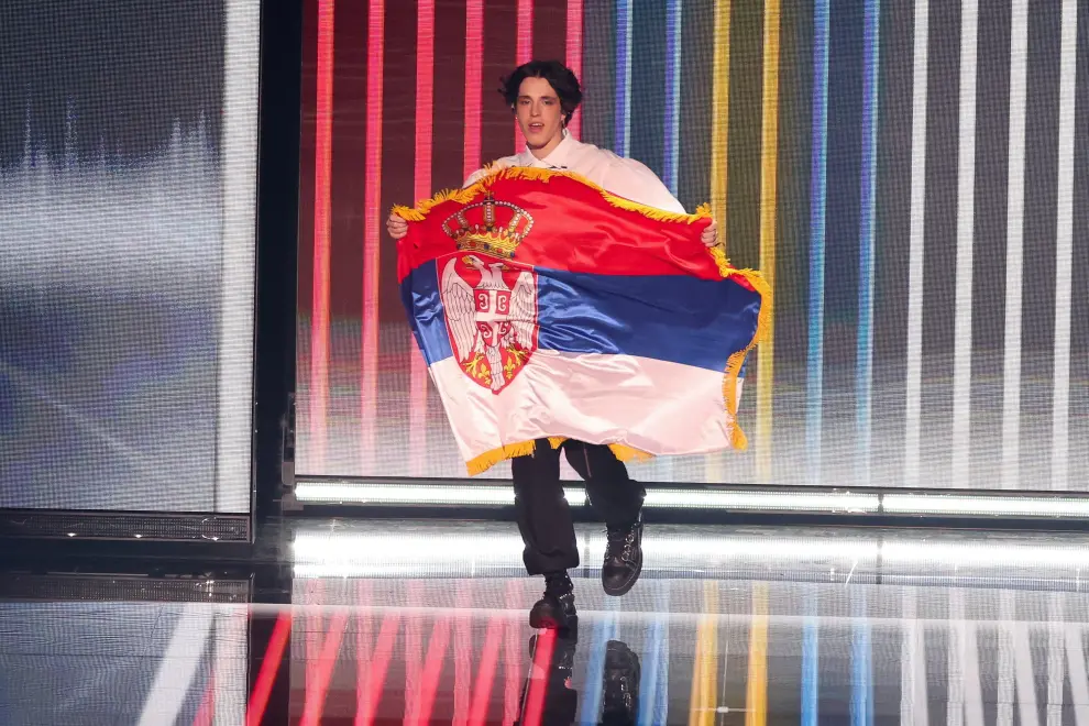 Remo Forrer from Switzerland holds her country's flag on stage during the grand final of the 2023 Eurovision Song Contest in Liverpool, Britain, May 13, 2023. REUTERS/Phil Noble MUSIC-EUROVISION/