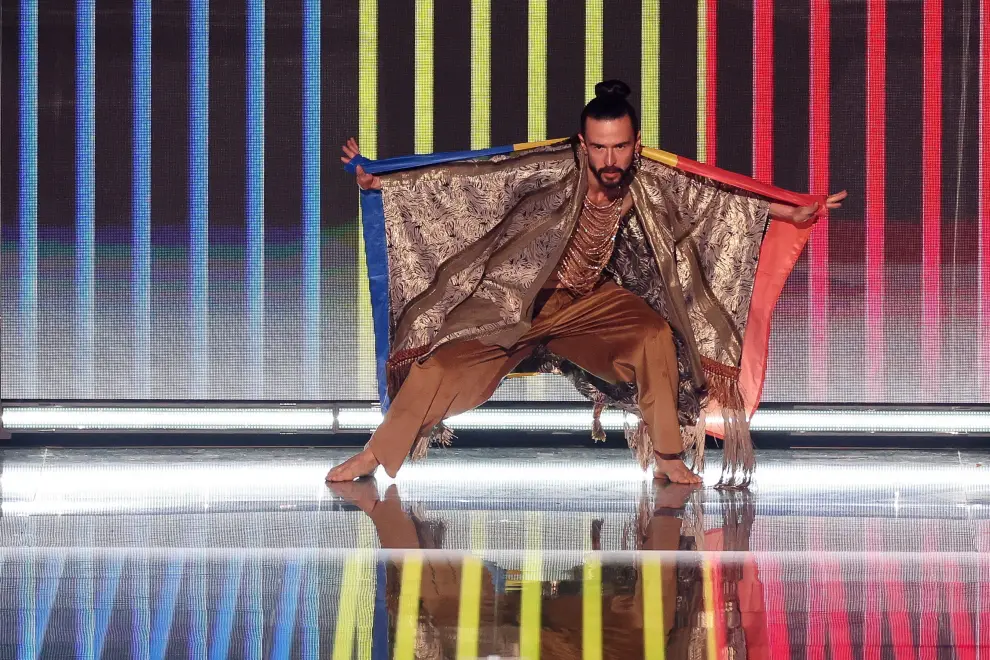 Gustaph from Belgium holds his country's flag on stage during the grand final of the 2023 Eurovision Song Contest in Liverpool, Britain, May 13, 2023. REUTERS/Phil Noble MUSIC-EUROVISION/