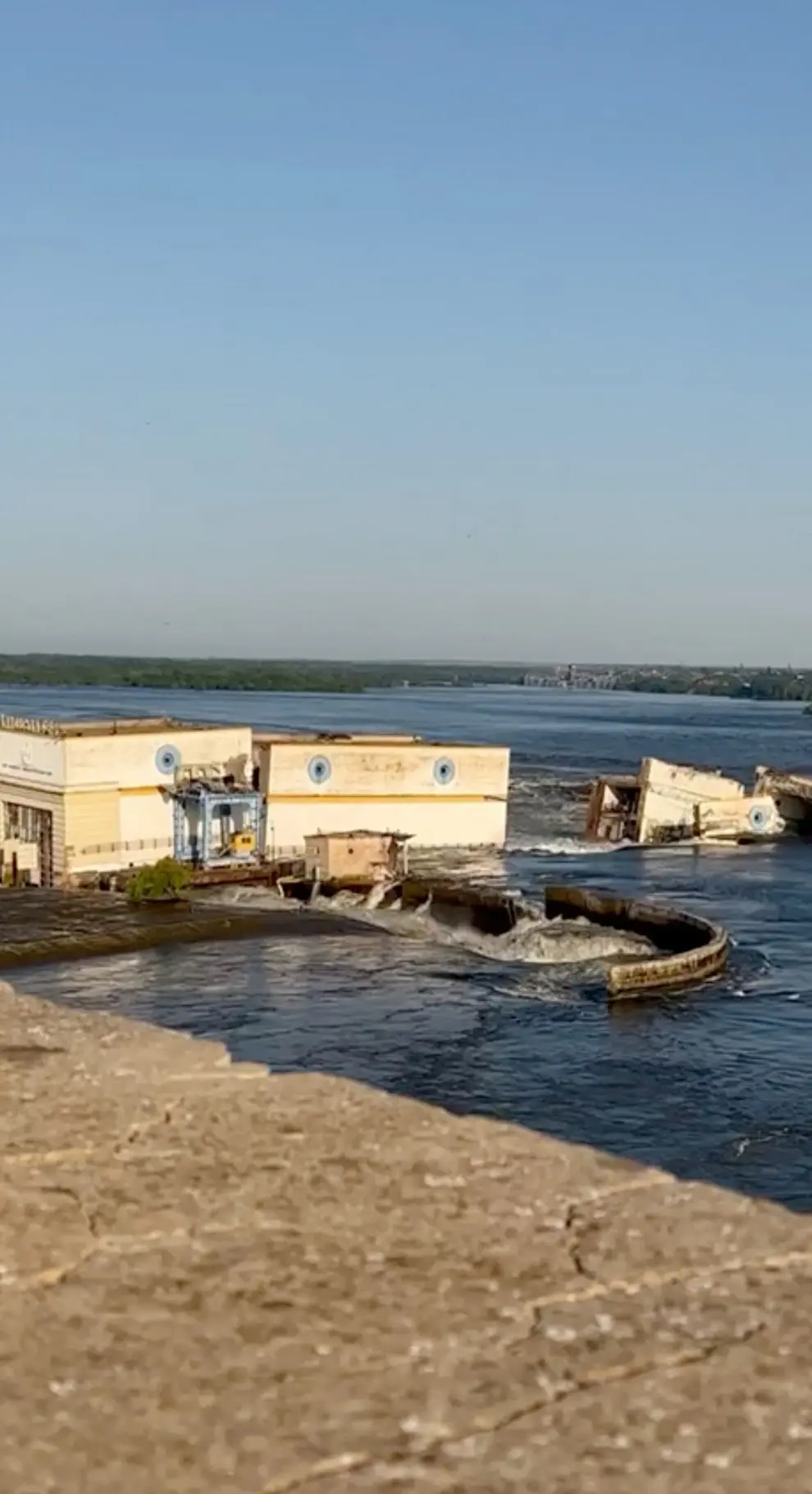Damaged buildings are seen as the Nova Kakhovka dam was breached in Kherson region, Ukraine June 6, 2023 in this screen grab taken from a video obtained by Reuters/via REUTERS    THIS IMAGE HAS BEEN SUPPLIED BY A THIRD PARTY. NO RESALES. NO ARCHIVES. UKRAINE-CRISIS/BLAST-DAM