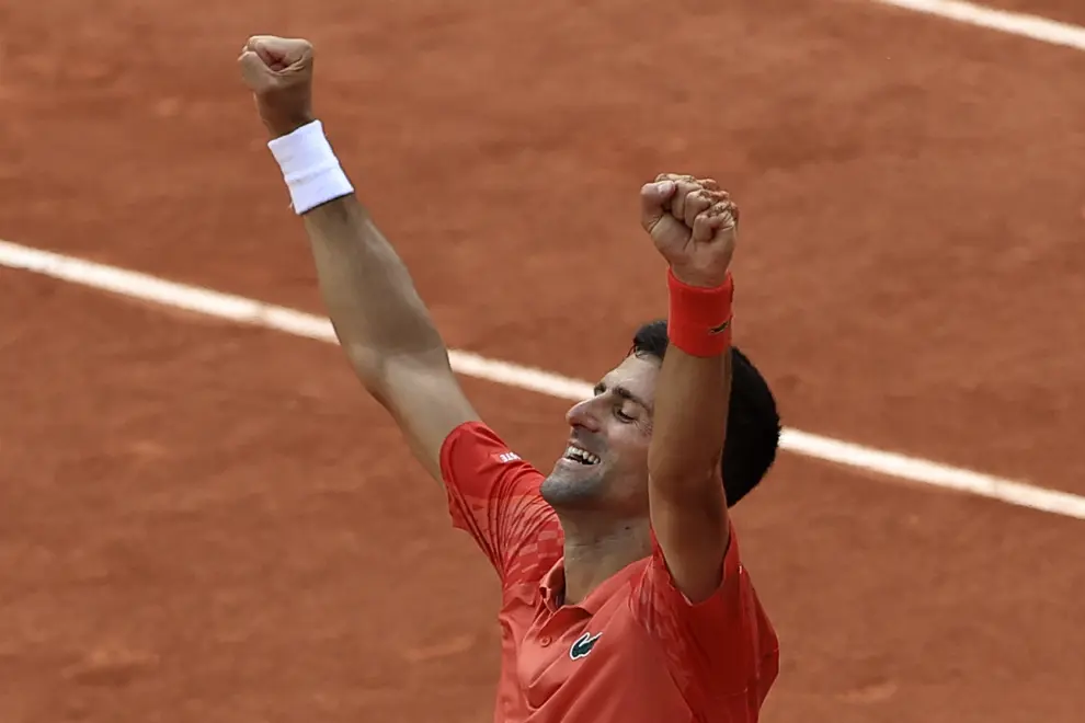 Serbia's Novak Djokovic celebrates winning the men's singles final match of the French Open tennis tournament against Norway's Casper Ruud in three sets, 7-6, (7-1), 6-3, 7-5, at the Roland Garros stadium in Paris, Sunday, June 11, 2023. Djokovic won his record 23rd Grand Slam singles title, breaking a tie with Rafael Nadal for the most by a man. (AP Photo/Aurelien Morissard)
