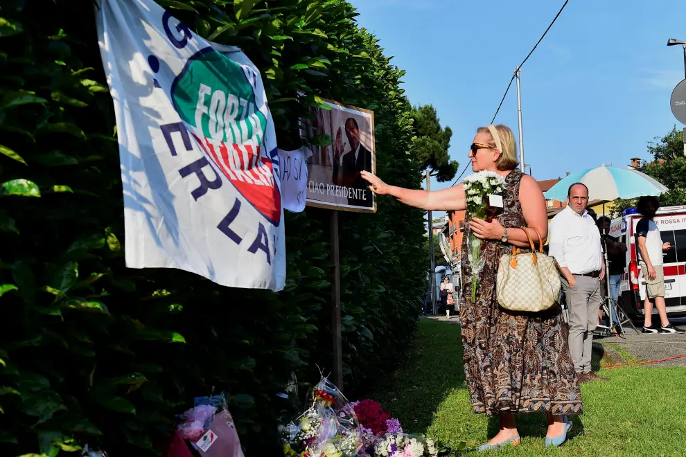 A man looks on as people pay their respects outside former Italian Prime Minister Silvio Berlusconi's house, to which his body was transported following his death, in Arcore near Milan, Italy, June 12, 2023. REUTERS/Massimo Pinca ITALY-BERLUSCONI/