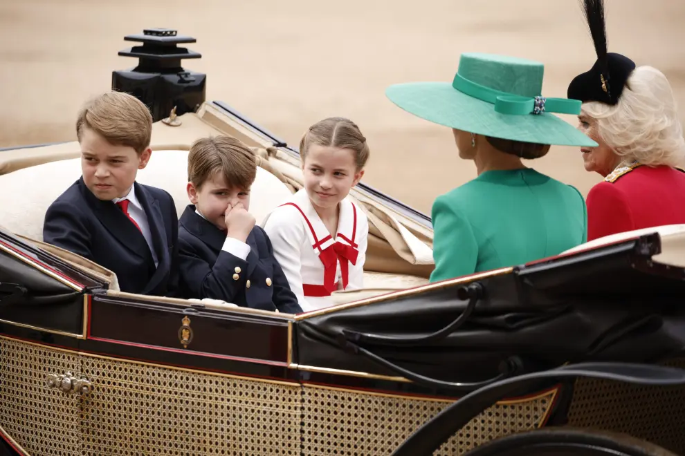 London (United Kingdom), 17/06/2023.- (L-R) Britain's Prince George, Prince Louis, Princess Charlotte and Catherine Princess of Wales at Trooping the Colour on Horse Guards Parade, London, Britain, 17 June 2023. The Trooping of the Colour traditionally marks the official birthday of the British sovereign and features a parade of over 1,400 soldiers, 200 horses and 400 musicians. This is King Charles III first Trooping as sovereign, joining the parade on horseback, marking the first time that the reigning monarch has ridden at this event since 1986. (Reino Unido, Londres) EFE/EPA/DAVID CLIFF
 BRITAIN ROYALS