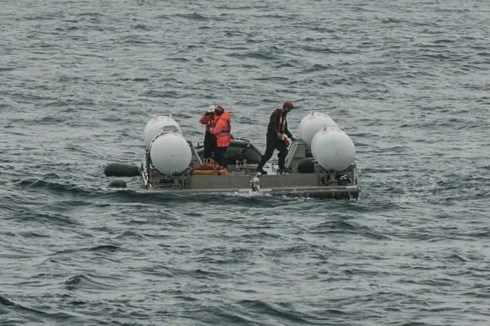In this photograph released by Action Aviation, the submersible Titan is to dive into the Atlantic Ocean on an expedition to the Titanic on Sunday, June 18, 2023. Rescuers in a remote area of the Atlantic Ocean raced against time Tuesday, June 20, 2023, to find a missing submersible carrying five people on a mission to document the wreckage of the Titanic. (Action Aviation via AP)