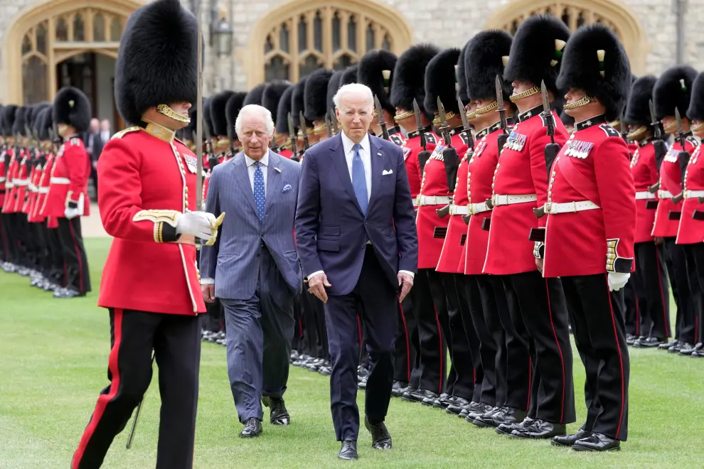 U.S. President Joe Biden stands with Britain's King Charles during a ceremony before their meeting at Windsor Castle in Windsor, England, Monday, July 10, 2023.  Kin Cheung/Pool via REUTERS USA-BIDEN/BRITAIN-WINDSOR