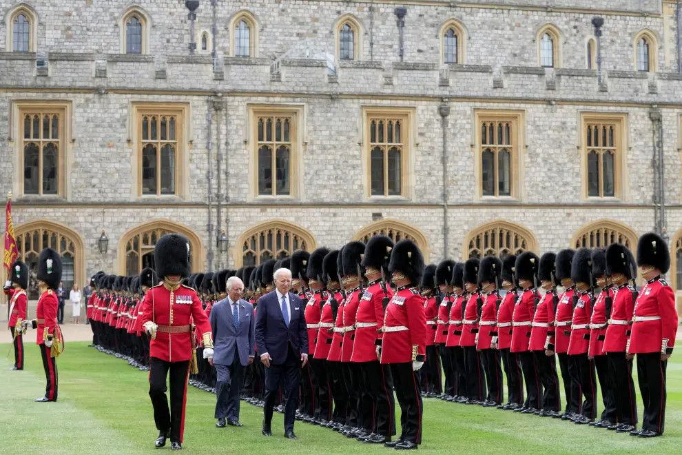 U.S. President Joe Biden and Britain's King Charles review an honour guard at Windsor Castle in Windsor, England, Monday, July 10, 2023. Kin Cheung/Pool via REUTERS USA-BIDEN/BRITAIN-WINDSOR