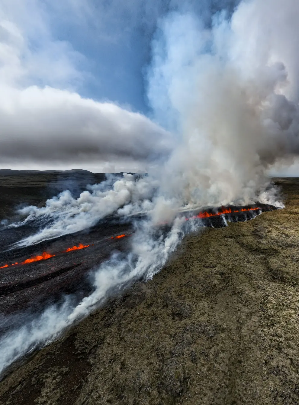 Lava flows as a volcano erupts on the Reykjanes peninsula in southwest Iceland, near the capital Reykjavik, July 10, 2023, in this handout picture. Icelandic Meteorological Office/Handout via REUTERS    THIS IMAGE HAS BEEN SUPPLIED BY A THIRD PARTY. NO RESALES. NO ARCHIVES. MANDATORY CREDIT. DO NOT OBSCURE LOGO. ICELAND-VOLCANO/