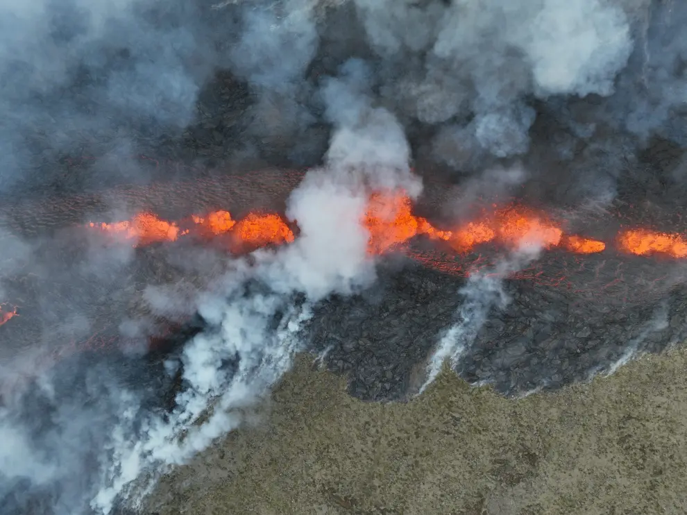 Lava flows after the eruption of a volcano, on the Reykjanes peninsula, near the capital Reykjavik, in southwest Iceland, July 10, 2023, in this picture obtained from social media. Juergen Merz - Glacier Photo Artist/via REUTERS  THIS IMAGE HAS BEEN SUPPLIED BY A THIRD PARTY. MANDATORY CREDIT. NO RESALES. NO ARCHIVES. ICELAND-VOLCANO/