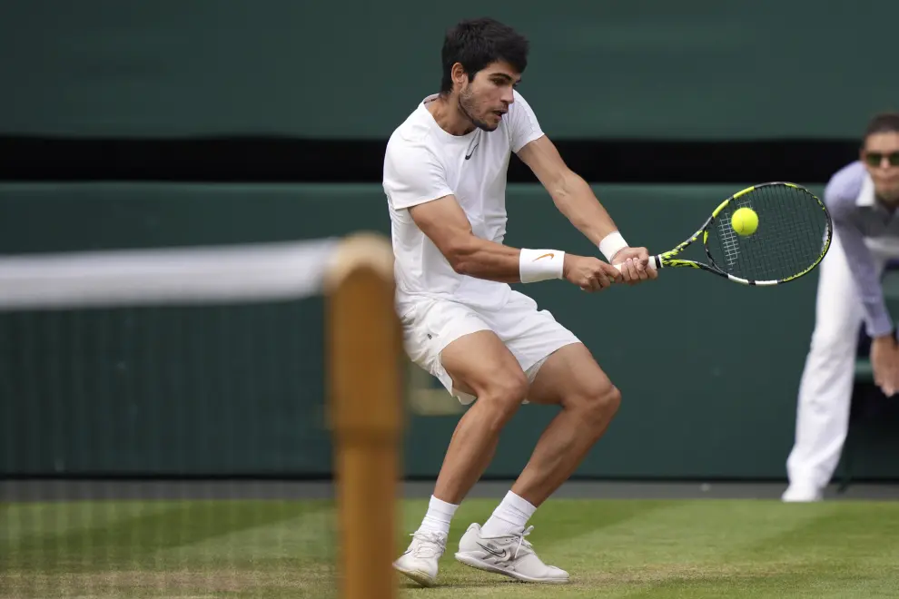 Spain's Carlos Alcaraz in action against Serbia's Novak Djokovic during the men's singles final on day fourteen of the Wimbledon tennis championships in London, Sunday, July 16, 2023. (AP Photo/Alberto Pezzali)