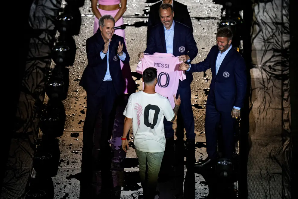 Jul 16, 2023; Ft. Lauderdale, FL, USA; Inter Miami CF forward Lionel Messi is introduced at The Unveil event and press conference on stage with Inter Miami CF managing owner Jorge Mas, Inter Miami CF co-owner Jose Mas, and Inter Miami CF co-owner David Beckham at DRV PNK Stadium. Mandatory Credit: Rich Storry-USA TODAY Sports SOCCER-USA/