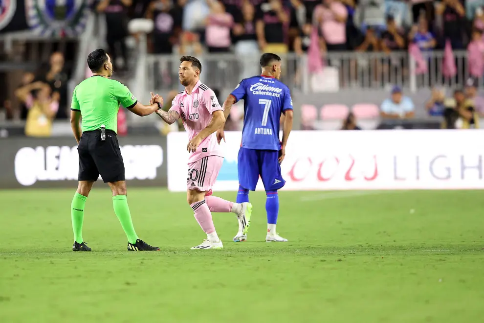 Jul 21, 2023; Fort Lauderdale, FL, USA; Inter Miami CF forward Lionel Messi (10) speaks with midfielder Sergio Busquetes (5) before checking in against Cruz Azul during the second half at DRV PNK Stadium. Mandatory Credit: Nathan Ray Seebeck-USA TODAY Sports SOCCER-USA/