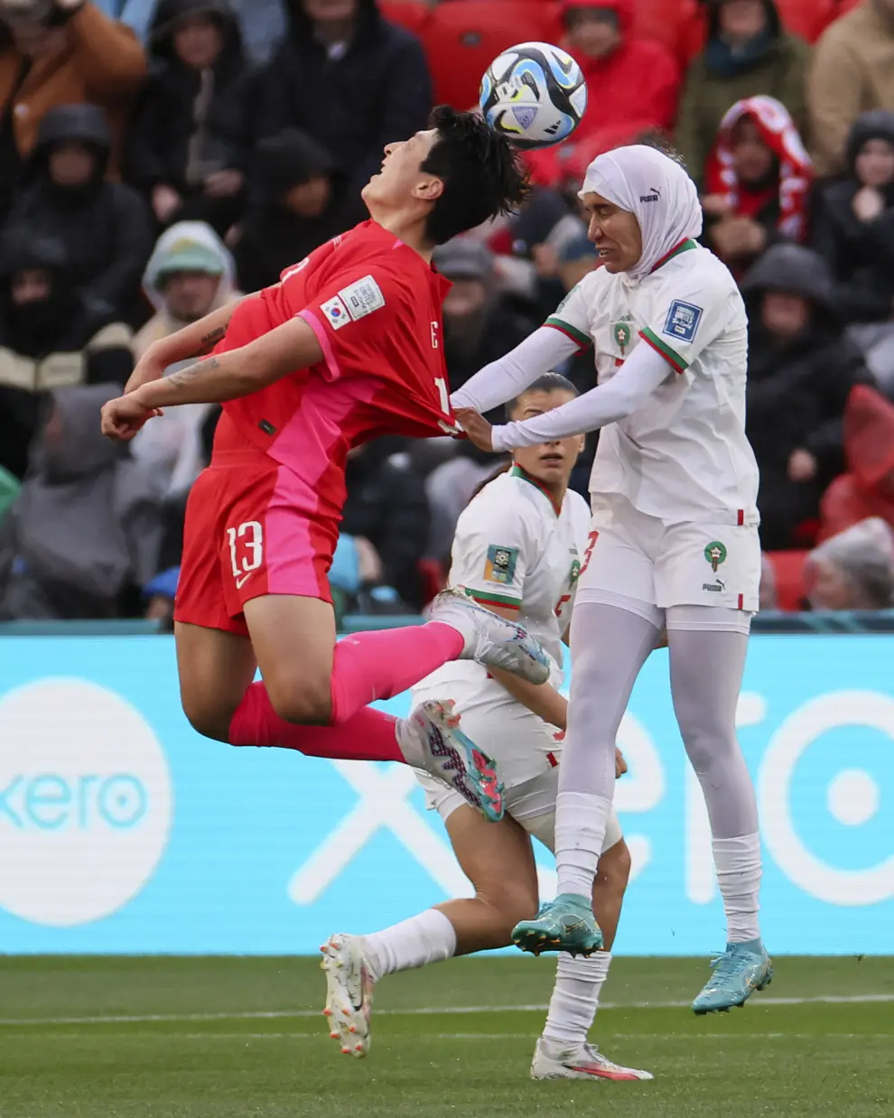South Korea's Park Eun-sun, left, and Morocco's Nouhaila Benzina compete for the ballduring the Women's World Cup Group H soccer match between South Korea and Morocco in Adelaide, Australia, Sunday, July 30, 2023. (AP Photo/James Elsby)