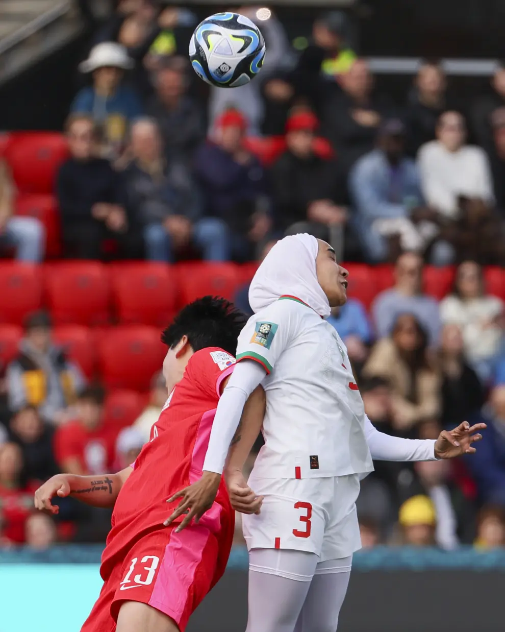 Morocco's Nouhaila Benzina, right, and South Korea's Park Eun-sun compete to head the ball during the Women's World Cup Group H soccer match between South Korea and Morocco in Adelaide, Australia, Sunday, July 30, 2023. (AP Photo/James Elsby)