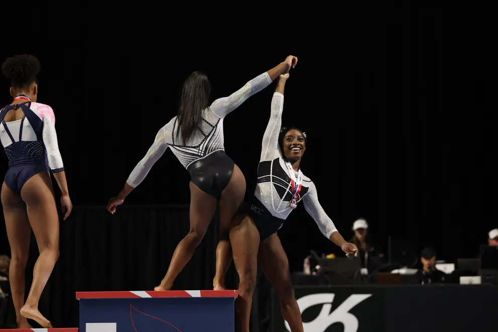 Aug 5, 2023; Hoffman Estates, Illinois, USA; Zoe Miller (left) and Simone Biles celebrate after medaling in the uneven bars in the Core Hydration Classic at NOW Arena. Mandatory Credit: Jon Durr-USA TODAY Sports GYMNASTICS/