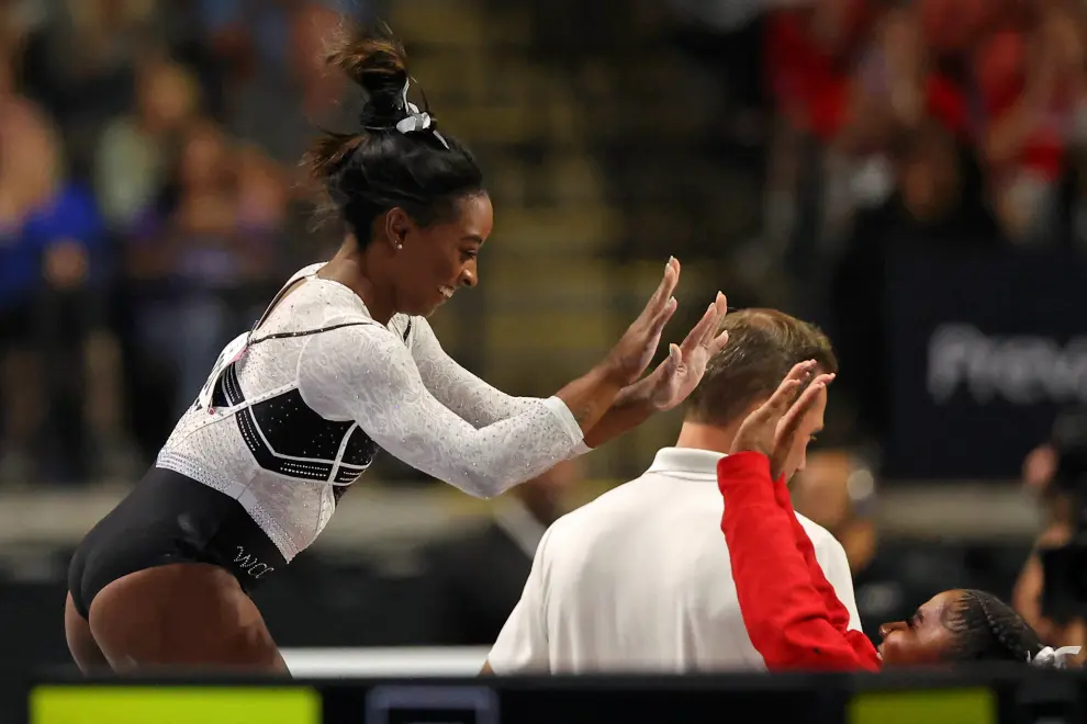 Aug 5, 2023; Hoffman Estates, Illinois, USA; Fans cheer as Simone Biles reacts after her vault during the Core Hydration Classic at NOW Arena. Mandatory Credit: Jon Durr-USA TODAY Sports GYMNASTICS/