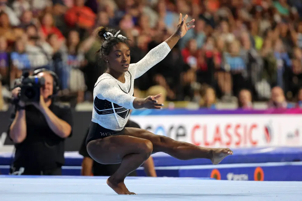 Aug 5, 2023; Hoffman Estates, Illinois, USA; Simone Biles performs on the floor exercise during the Core Hydration Classic at NOW Arena. Mandatory Credit: Jon Durr-USA TODAY Sports GYMNASTICS/