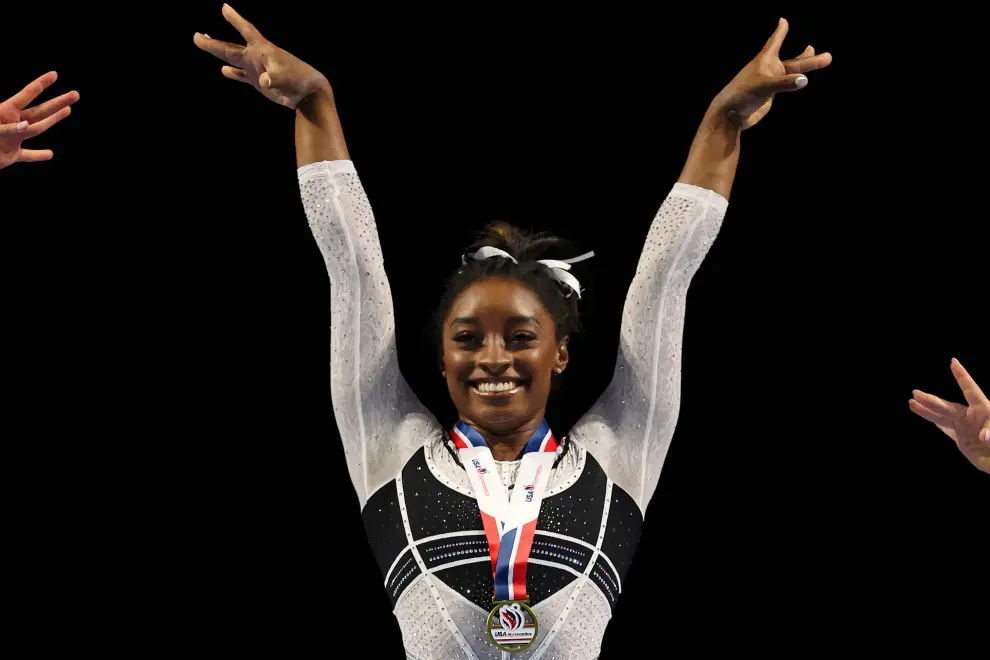 Simone Biles talks to the news media after winning the all-around of the Core Hydration Classic at NOW Arena in Hoffman Estates, Illinois, U.S. August 5, 2023. Jon Durr/USA TODAY Sports via REUTERS  MANDATORY CREDIT GYMNASTICS/