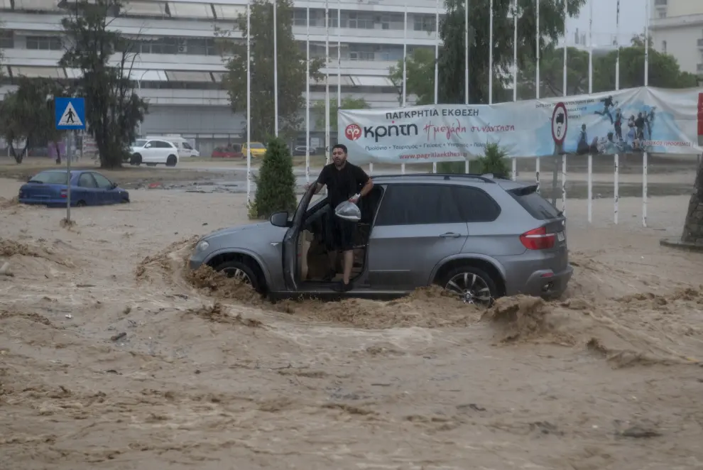 Volos (Greece), 06/09/2023.- A man is trying to get out of his car on a flooded road during the storm named Daniel in the area of Volos, Magnesia, Greece, 06 September 2023. A man died as unprecedented bad weather conditions have stricken the region of Magnesia and the city of Volos on 05 September. Meanwhile, the region of Magnesia was faced with heavy storm overnight which lasted for over 10 hours and the phenomena are expected to continue until 06 September. (tormenta, Grecia) EFE/EPA/HATZIPOLITIS NICOLAOS

