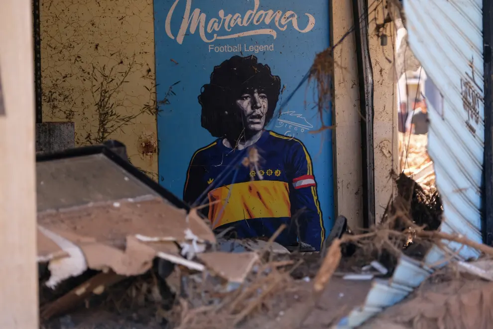 A poster of late Argentine soccer legend Diego Maradona is seen between the rubble, after a powerful storm and heavy rainfall hit Libya, in Derna, Libya September 13, 2023. REUTERS/Esam Omran Al-Fetori