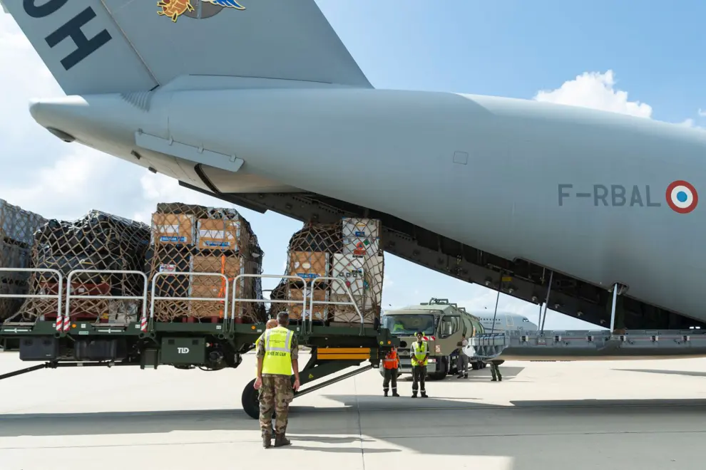 In this photo provided bye the French Army, soldiers load a cargo plane with disaster relief for Libya, Wednesday, Sept. 13, 2023 at the Istres military base, southern France. A Libyan local health official said the toll in Libya has reached more than 5,100 dead and is expected to rise further in the eastern city of Derna where floods caused massive devastation over the weekend. French government' s spokesman said a French rescue team of about 50 people aim at being "operational within 48 hours" in Libya. (État-Major des Armees via AP)