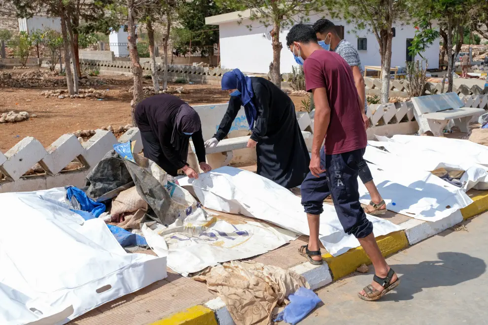 People look at the dead bodies outside the hospital, after a powerful storm and heavy rainfall hit Libya, in Derna, Libya September 12, 2023. REUTERS/Esam Omran Al-Fetori REFILE - QUALITY REPEAT