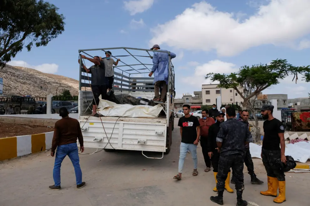People put the dead bodies on a truck outside the hospital, after a powerful storm and heavy rainfall hit Libya, in Derna, Libya September 12, 2023. REUTERS/Esam Omran Al-Fetori REFILE - QUALITY REPEAT