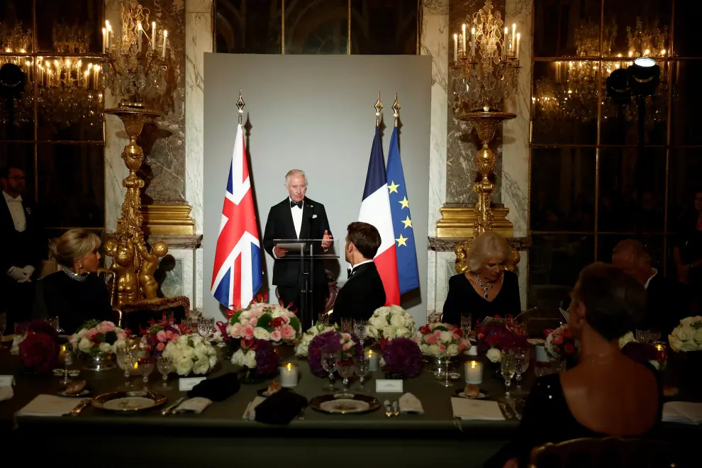 Britain's King Charles listens to the speech of French President Emmanuel Macron during a state dinner in the Hall of Mirrors (Galerie des Glaces) at the Chateau de Versailles (Versailles Palace) in Versailles, near Paris, on the first day of their State visit to France, September 20, 2023. REUTERS/Benoit Tessier/Pool BRITAIN-ROYALS/FRANCE