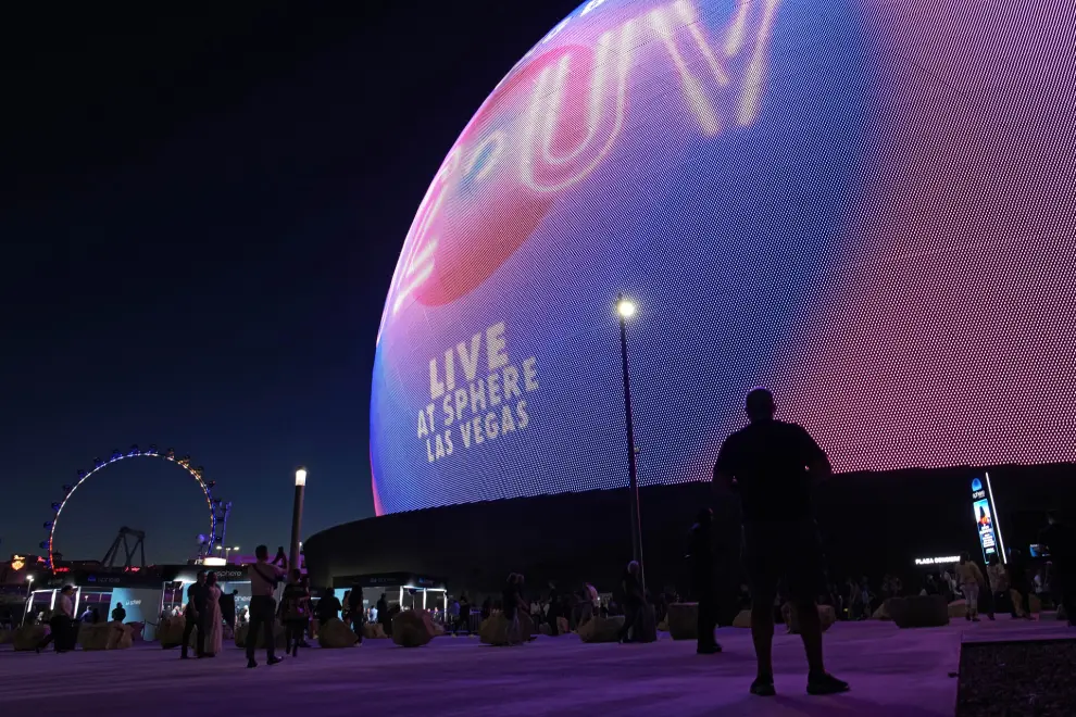 People arrive for the opening night of the Sphere and U2'S “UV Achtung Baby" show, Friday, Sept. 29, 2023, in Las Vegas. (AP Photo/John Locher)