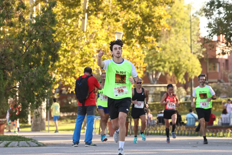 Fotos de los participantes en la carrera 10K del Pilar en Zaragoza.