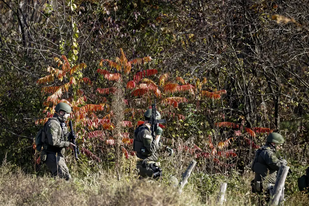 Members of law enforcement arrive at a farm, as the search for the suspect in the deadly mass shootings in Lewiston continues, in Lisbon Falls, Maine, U.S. October 27, 2023. REUTERS/Kevin Lamarque MAINE-SHOOTING/